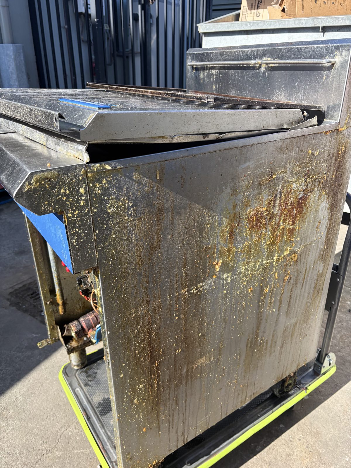Cabinet side — the same panel, same angle, after the pass — before dry ice cleaning