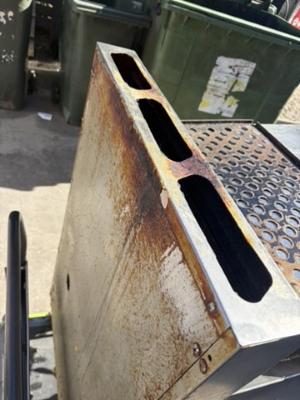 Backsplash and perforated crumb screen — rust and baked residue off — before dry ice cleaning