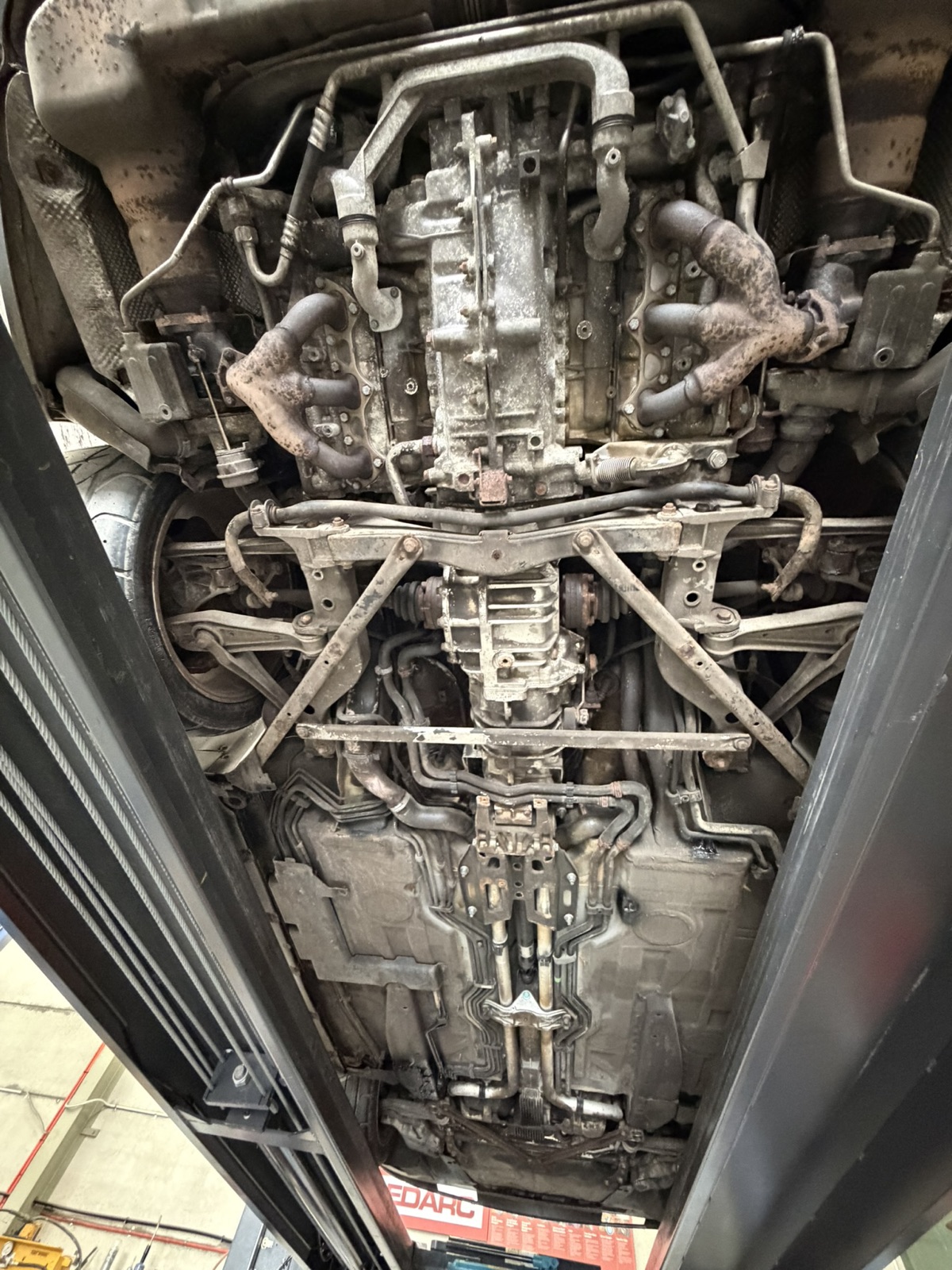 Engine underside and exhaust manifolds — before dry ice cleaning