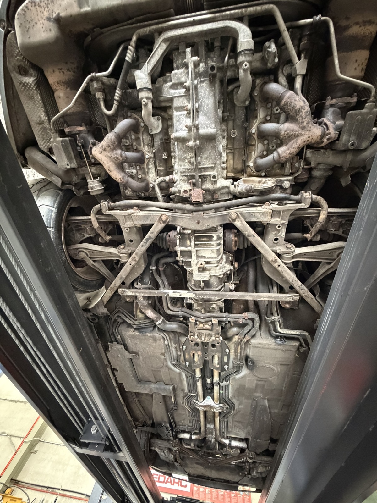 Gearbox, rear subframe and undertray, looking forward — before dry ice cleaning