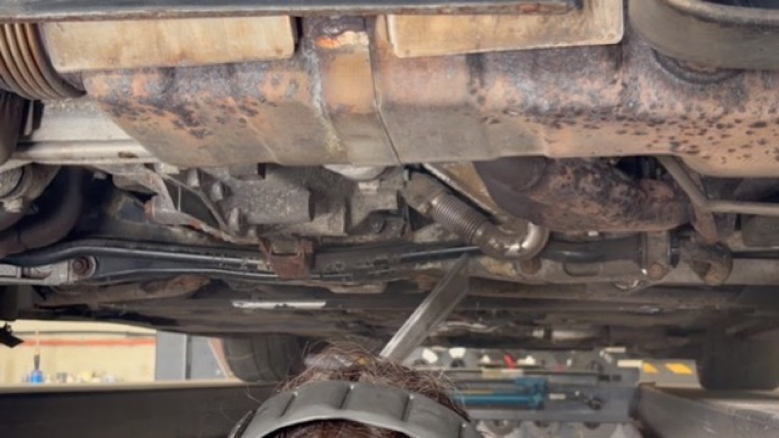 Surface corrosion on exhaust and heat shield before cleaning