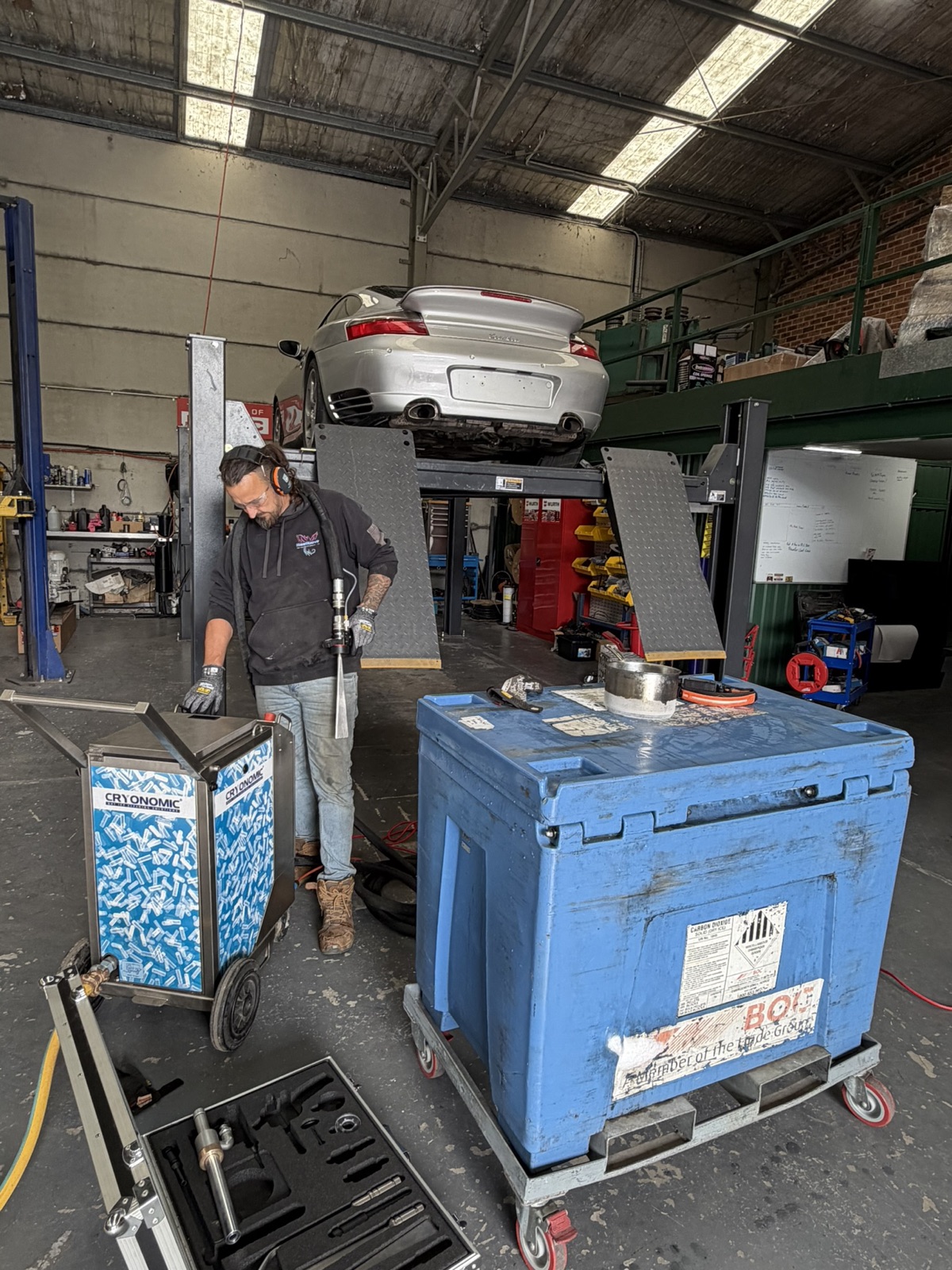Cryonomic dry ice blasting unit and insulated pellet bin in the workshop