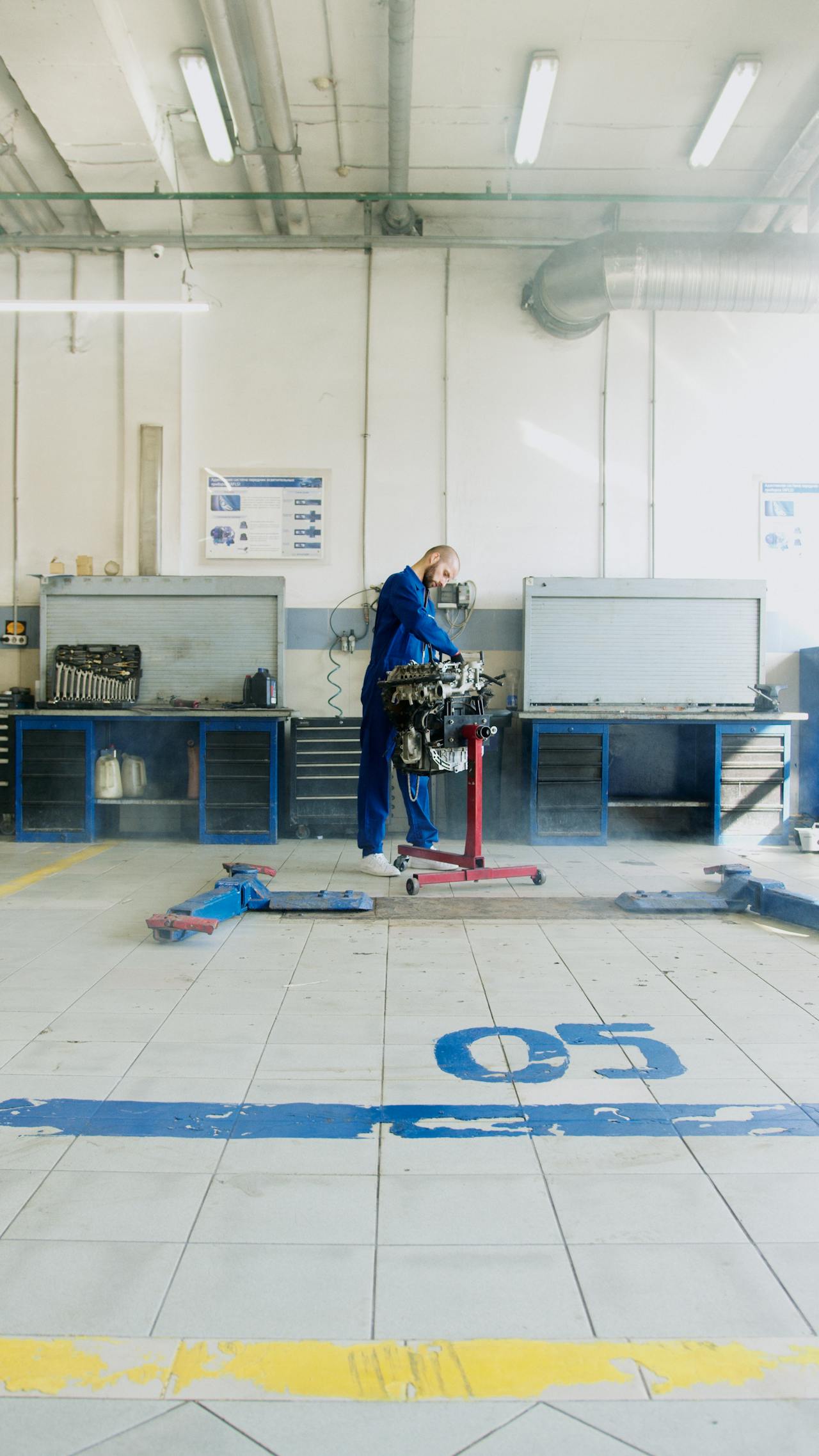 Technician loading 3mm CO2 pellets into a blasting rig hopper